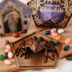 Image produit Figurine Grenouille en chocolat avec carte à collectionner - Réplique Harry Potter