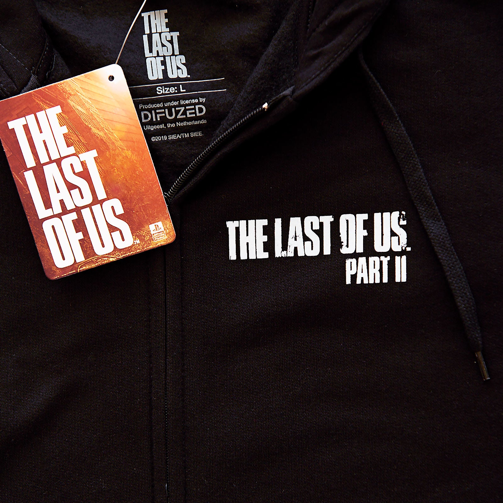 Image produit The Last of Us - Sweat à capuche noir avec logo Fireflies