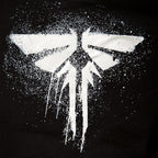 Image produit The Last of Us - Sweat à capuche noir avec logo Fireflies