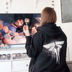 Image produit The Last of Us - Sweat à capuche noir avec logo Fireflies