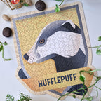 Image produit Harry Potter - Puzzle de l'écusson de Poufsouffle dans une bouteille de potion magique avec bouchon en liège